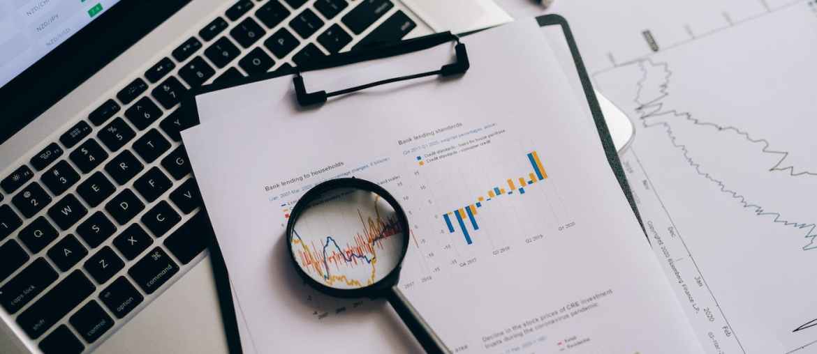 Image of a computer and a paper with process mining data