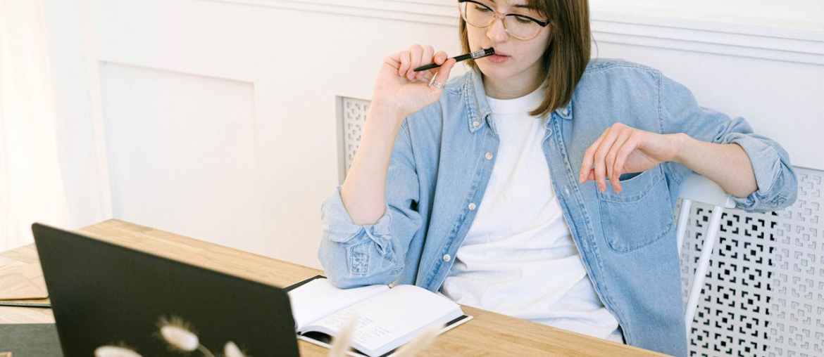 Image of a woman researching blue prism alternatives on her laptop