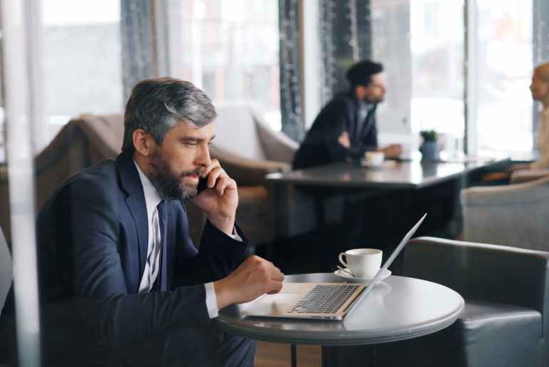 Image of a man researching robocorp alternatives on his laptop